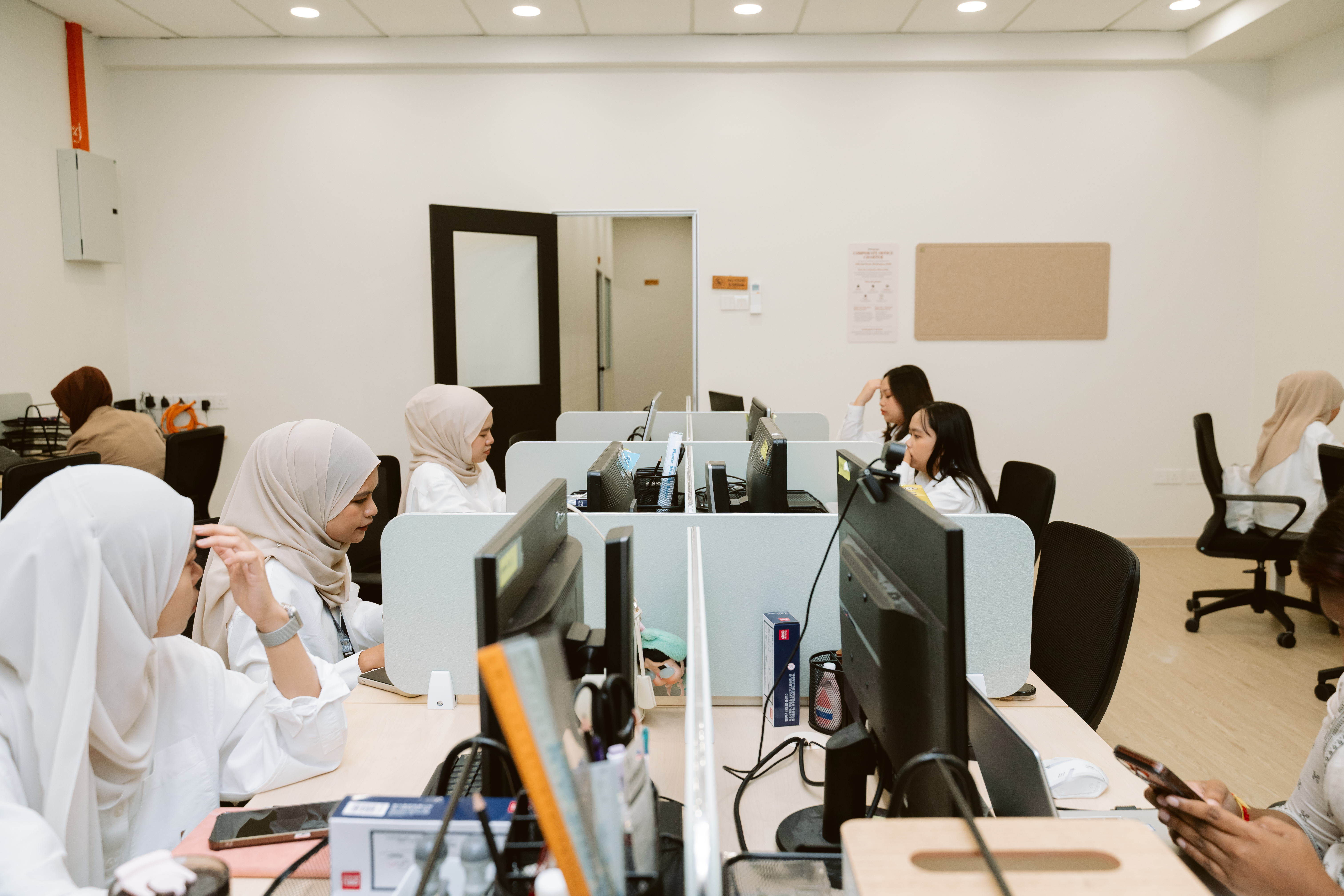 D’Senyum corporate office team at work